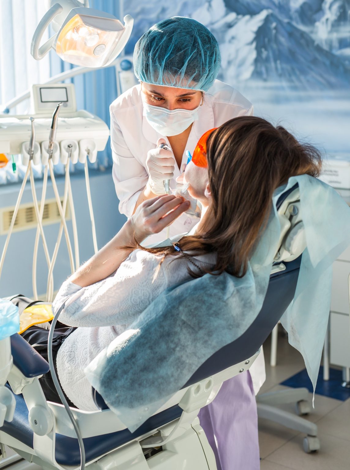 Young woman getting dental treatment.