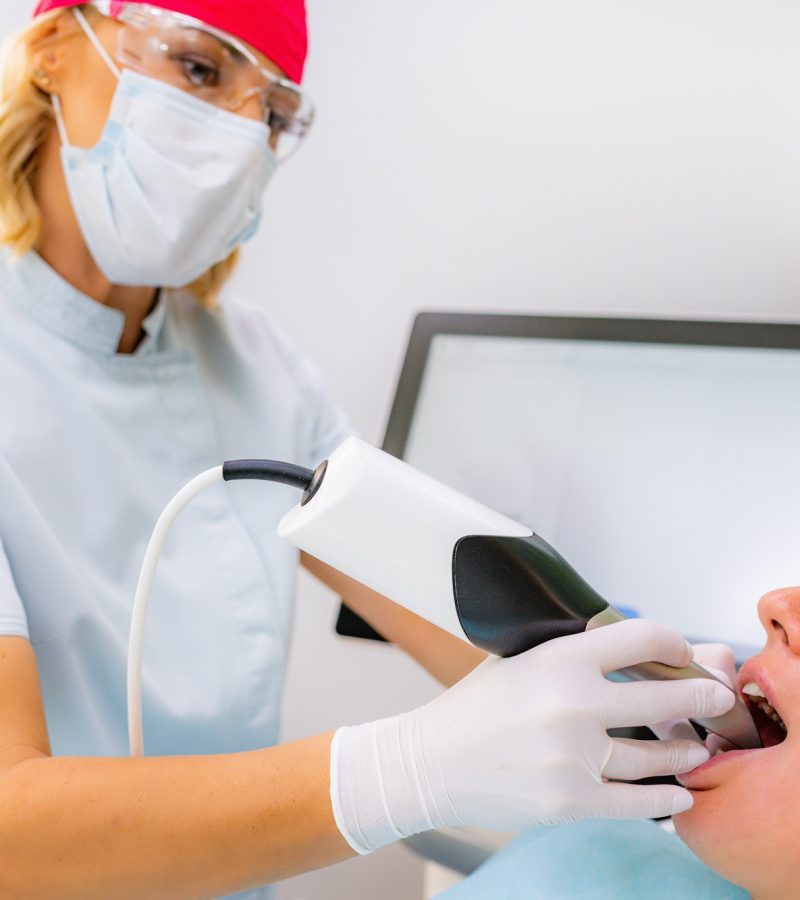 Dental Prosthodontics. Dentist Using 3D Camera in Teeth Reconstruction Procedure