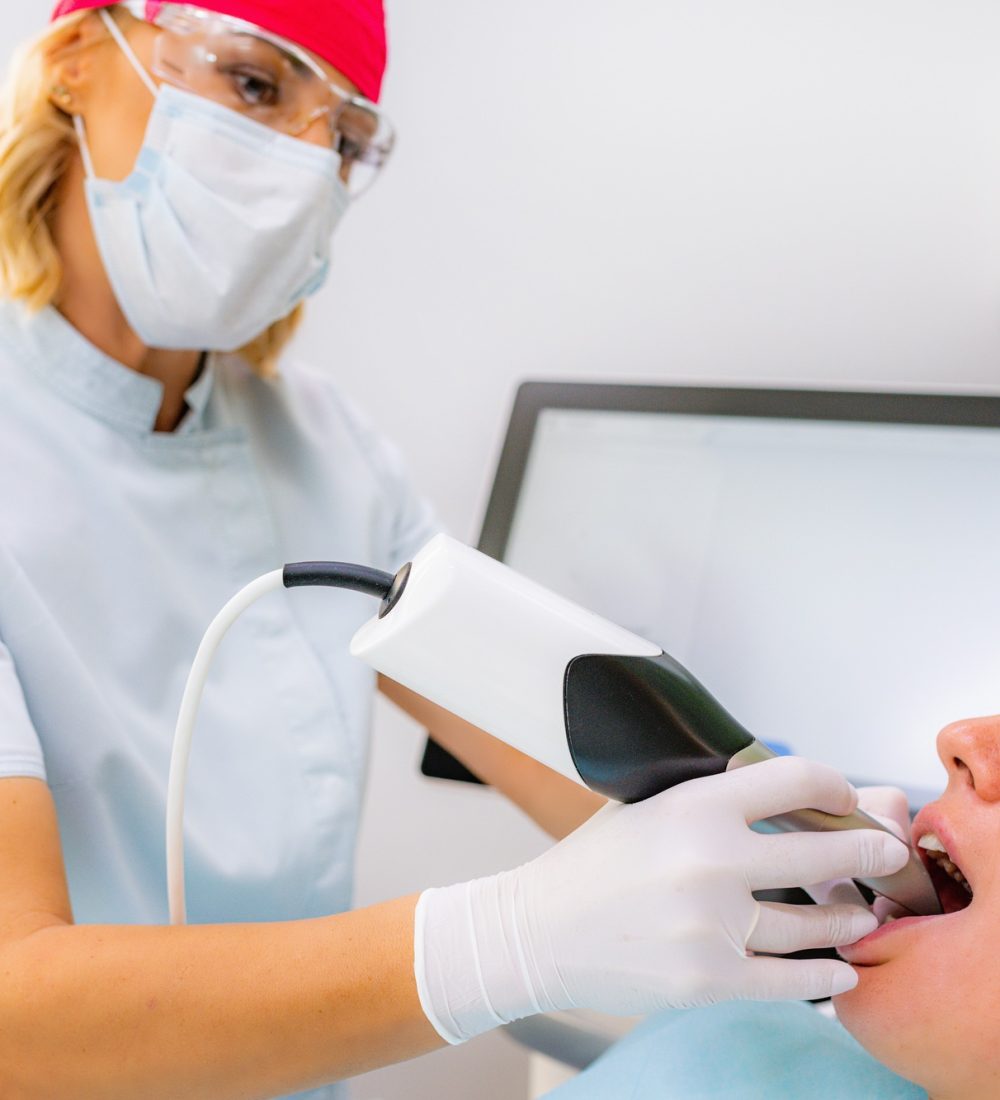 Dental Prosthodontics. Dentist Using 3D Camera in Teeth Reconstruction Procedure